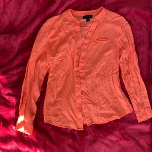 Cute orange blouse in perfect condition. Just needs to be ironed